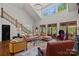 Inviting living room with soaring ceilings, ample seating, and natural light at 19501 River Falls Dr, Davidson, NC 28036
