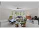 Comfortable living room with bay window, ceiling fan and cozy seating arrangement, ideal for relaxing or entertaining at 19501 River Falls Dr, Davidson, NC 28036