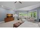 Bright main bedroom with carpet, many large windows, a seating area, and natural light at 19501 River Falls Dr, Davidson, NC 28036