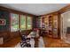 Elegant office with custom built-in bookshelves and large window at 19501 River Falls Dr, Davidson, NC 28036