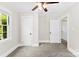 Bedroom featuring carpet, a window, and two closets at 2008 Highland St, Charlotte, NC 28208