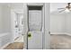 Laundry closet with a stacked washer and dryer, located off the adjacent bedroom at 2008 Highland St, Charlotte, NC 28208