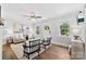 Bright living room with hardwood floors, neutral decor, and large windows showcasing natural light at 2008 Highland St, Charlotte, NC 28208