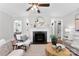Cozy living room with a fireplace, stylish seating, and neutral color palette at 2008 Highland St, Charlotte, NC 28208