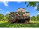 Brick home exterior features a spacious back deck and a sprawling lawn at 2025 Groves Edge Ln, Waxhaw, NC 28173