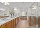 Large bathroom with double vanity, bathtub, and glass-enclosed shower at 2025 Groves Edge Ln, Waxhaw, NC 28173