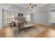 Spacious main bedroom with tray ceilings, ceiling fan, hardwood floors, and cozy decor at 2025 Groves Edge Ln, Waxhaw, NC 28173