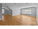 Spacious bonus room features hardwood floors, natural light, and recessed lighting at 2025 Groves Edge Ln, Waxhaw, NC 28173