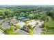 Aerial view of a neighborhood with an attractive pool, tennis courts, and clubhouse at 2025 Groves Edge Ln, Waxhaw, NC 28173