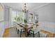 Bright dining room with natural light, a wooden table, and seating for six at 2025 Groves Edge Ln, Waxhaw, NC 28173