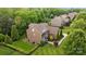 Beautiful brick home with well-manicured lawn and lush landscaping in a desirable neighborhood setting at 2025 Groves Edge Ln, Waxhaw, NC 28173