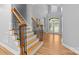 Elegant foyer with a staircase, wood floors, and a view of the front door at 2025 Groves Edge Ln, Waxhaw, NC 28173
