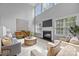 Stunning living room with soaring ceilings, fireplace, and ample natural light at 2025 Groves Edge Ln, Waxhaw, NC 28173