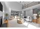 Spacious open-concept living room and kitchen area with fireplace and abundant natural light at 2025 Groves Edge Ln, Waxhaw, NC 28173