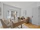 Bright office features a bay window, hardwood floors, and comfortable seating area, creating an ideal workspace at 2025 Groves Edge Ln, Waxhaw, NC 28173