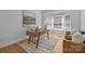 Well-lit office with a modern desk, comfortable seating, and a large window at 2025 Groves Edge Ln, Waxhaw, NC 28173
