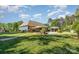 Expansive backyard with a well-manicured lawn, fenced perimeter, and in-ground pool with gazebo at 219 Reese Wilson Rd, Belmont, NC 28012