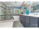 Bright bathroom with dual vanity, separate shower, and soaking tub at 219 Reese Wilson Rd, Belmont, NC 28012