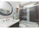 Bathroom with modern sink, toilet, and shower with glass door at 219 Reese Wilson Rd, Belmont, NC 28012