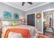 Comfortable bedroom with a queen-size bed, neutral colors, and a bright window at 219 Reese Wilson Rd, Belmont, NC 28012