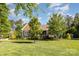 Charming home featuring a lush green lawn and well-maintained landscaping and traditional American architecture at 219 Reese Wilson Rd, Belmont, NC 28012