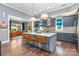 Bright kitchen features stainless appliances, ample storage space, and an island with seating at 219 Reese Wilson Rd, Belmont, NC 28012
