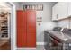 Functional laundry room with washer, dryer, storage, and laundry sign on the wall at 219 Reese Wilson Rd, Belmont, NC 28012