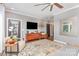 Well-lit living room featuring a TV, wood floors, and stylish furniture at 219 Reese Wilson Rd, Belmont, NC 28012