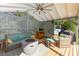 Covered outdoor space boasts comfortable seating around a fire pit and a built-in grilling area at 219 Reese Wilson Rd, Belmont, NC 28012