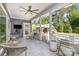 Spacious covered porch with ceiling fan and view of pool and cabana at 219 Reese Wilson Rd, Belmont, NC 28012