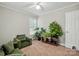 Cozy bedroom with neutral tones, an accent chair, and a variety of plants at 2379 Whitley Rd, Fort Mill, SC 29708