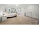 Spacious primary bedroom featuring neutral color palette, desk, and carpet flooring at 2379 Whitley Rd, Fort Mill, SC 29708