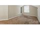Bedroom with neutral-colored carpet, a window with blinds, and a recessed space at 2379 Whitley Rd, Fort Mill, SC 29708