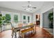 The dining room features wood floors, neutral walls, and double doors leading to a private deck and outdoor space at 2379 Whitley Rd, Fort Mill, SC 29708