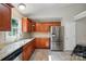 Well-lit kitchen featuring wood cabinets, stainless steel appliances, and granite countertops at 2379 Whitley Rd, Fort Mill, SC 29708