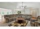 Spacious living room with an extra large sectional sofa, ceiling fan, and modern decor at 2379 Whitley Rd, Fort Mill, SC 29708