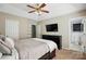 Main bedroom featuring a ceiling fan, built in shelving, a closet, neutral walls, and an ensuite bathroom at 2379 Whitley Rd, Fort Mill, SC 29708
