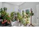 Bright sunroom filled with plants and natural light from large window at 2379 Whitley Rd, Fort Mill, SC 29708
