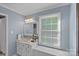 Bright bathroom with a marble countertop vanity and a large window providing natural light at 2500 Little Cove Rd, Charlotte, NC 28270