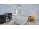 Serene bedroom with light blue walls, a comfortable bed, and a functional workspace at 2500 Little Cove Rd, Charlotte, NC 28270