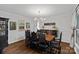 Elegant dining room featuring dark wood furniture, wainscoting, and a stylish chandelier at 2500 Little Cove Rd, Charlotte, NC 28270