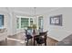 Dining area with a bay window that allows for a sun-drenched space for a beautiful view at 2500 Little Cove Rd, Charlotte, NC 28270