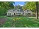 Charming two-story home featuring a welcoming front porch and lush green lawn at 2500 Little Cove Rd, Charlotte, NC 28270