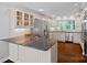 Bright kitchen with stainless steel appliances, granite countertops, and wooden floors at 2500 Little Cove Rd, Charlotte, NC 28270
