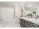 Bathroom showcasing a vanity with dual sinks and a shower and tub combo at 2600 Oakmeade Dr, Charlotte, NC 28270