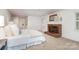 Bright bedroom featuring a cozy fireplace with brick surround and a serene Primary ensuite bathroom at 2600 Oakmeade Dr, Charlotte, NC 28270