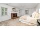 Serene bedroom with fireplace, natural light, and neutral tones, creating a peaceful retreat at 2600 Oakmeade Dr, Charlotte, NC 28270