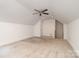 Spacious bonus room with a ceiling fan, bright lighting, and a large window at 2600 Oakmeade Dr, Charlotte, NC 28270