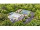 Aerial view of community amenities featuring pool, tennis court, playground, and clubhouse, enhancing the neighborhood appeal at 2600 Oakmeade Dr, Charlotte, NC 28270