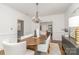 Bright dining room with an oval table, chandelier and hardwood floors at 2600 Oakmeade Dr, Charlotte, NC 28270